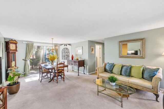 33 Swift Brook Rd, South Yarmouth, MA 02664 - carpeted living room with an inviting chandelier