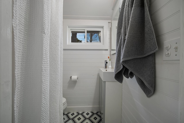 bathroom featuring tile patterned floors, vanity, and toilet