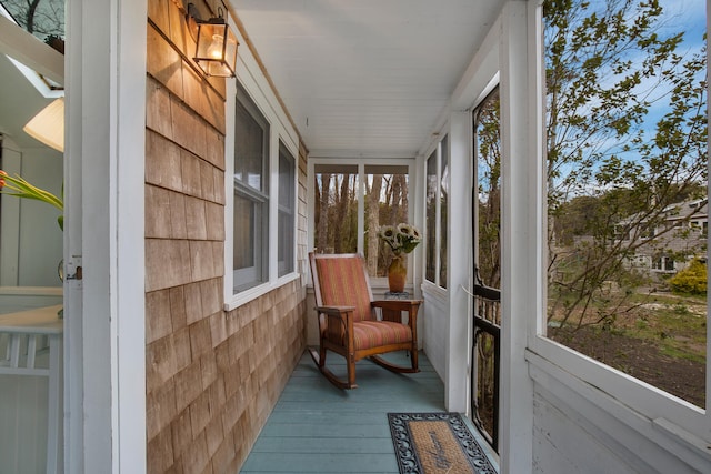 sunroom / solarium with hardwood / wood-style floors