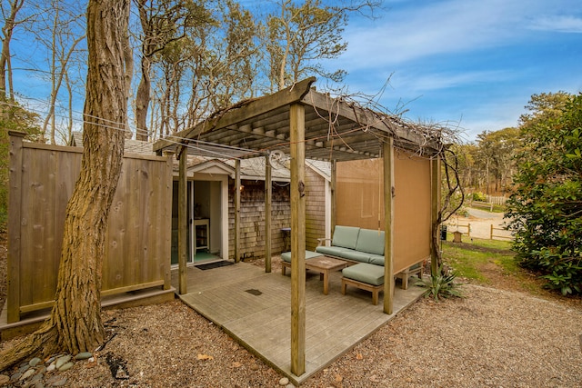 view of patio / terrace featuring fence, an outdoor living space, and a deck