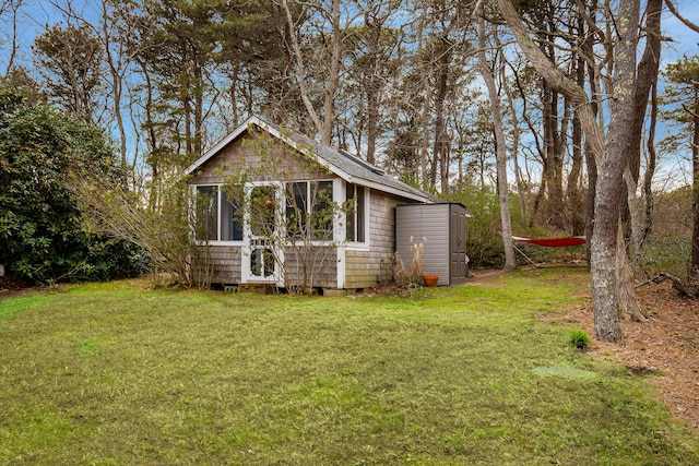 exterior space with a yard and an outdoor structure