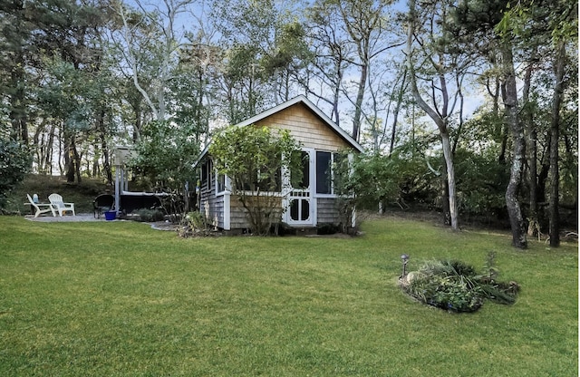 exterior space with a yard and an outdoor structure