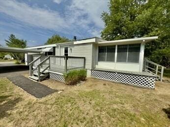 37 Washington Park, Carver, MA 02330 - back of property with a wooden deck and a sunroom