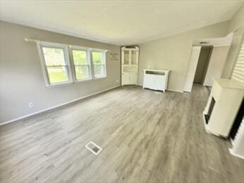 37 Washington Park, Carver, MA 02330 - unfurnished living room featuring wood finished floors and a fireplace