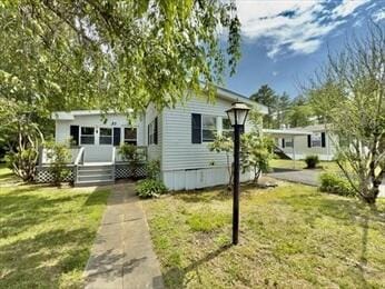 37 Washington Park, Carver, MA 02330 - manufactured / mobile home with a deck and a front lawn