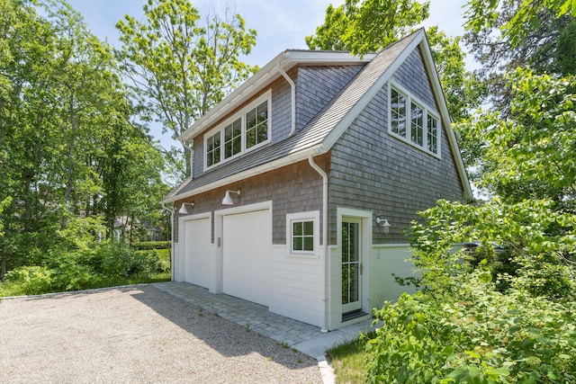 view of side of property with a garage