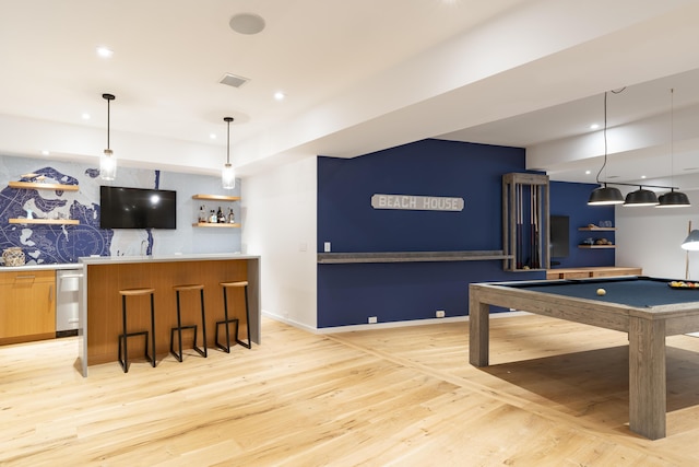 rec room featuring indoor bar, light wood-type flooring, and pool table