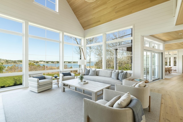 sunroom featuring wooden ceiling, a water view, and vaulted ceiling