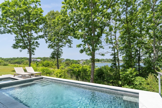 view of pool featuring a water view