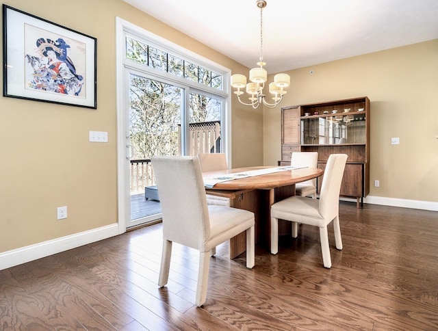 dining area featuring baseboards, an inviting chandelier, and dark wood-style flooring