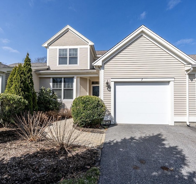 7 Sea Spray Ave, Mashpee, MA 02649 - traditional-style house featuring asphalt driveway and a garage