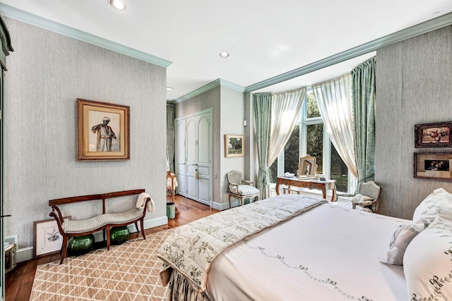 bedroom featuring hardwood / wood-style floors, a closet, and ornamental molding