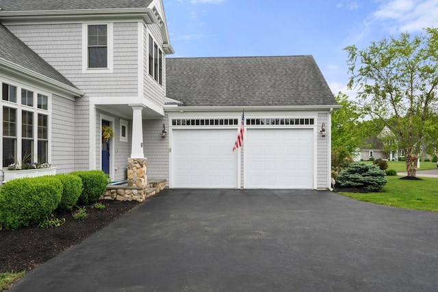 23 Ridgehill Ln, Sagamore Beach, MA 02562 - view of front of house featuring a shingled roof, asphalt driveway, and an attached garage