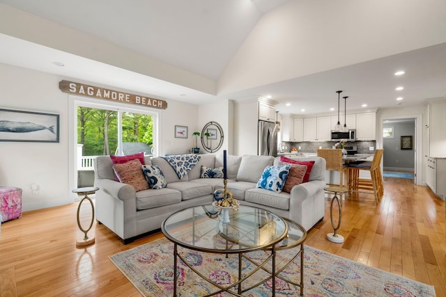 23 Ridgehill Ln, Sagamore Beach, MA 02562 - living area featuring light wood-style flooring, vaulted ceiling, recessed lighting, and baseboards