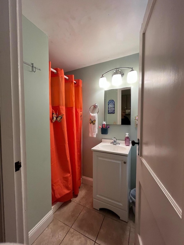 1435 State Hwy, Eastham, MA 02642 - bathroom with a shower with curtain, tile patterned flooring, vanity, baseboards, and toilet
