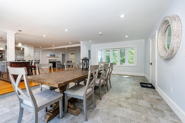 dining space featuring decorative columns