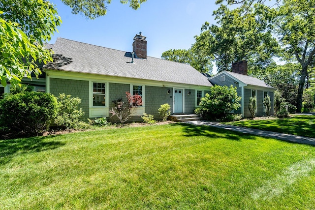 ranch-style home with a front lawn