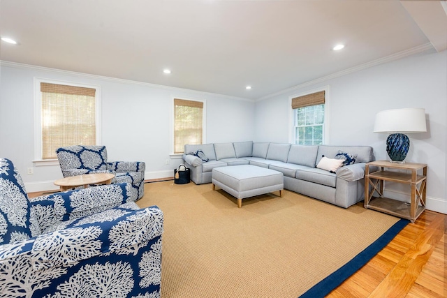 living room with hardwood / wood-style flooring and ornamental molding