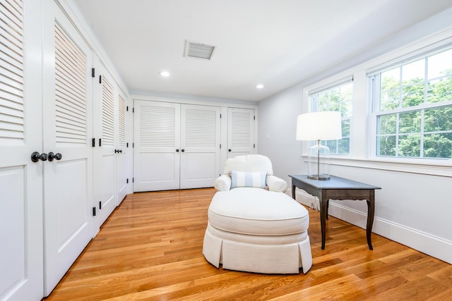 sitting room with light hardwood / wood-style floors