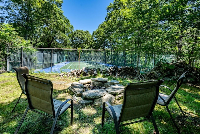 view of yard featuring tennis court