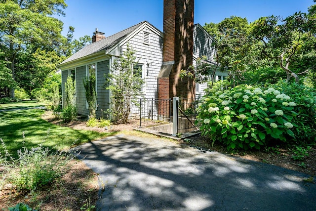 view of home's exterior featuring a yard