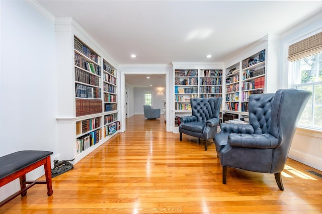 sitting room featuring plenty of natural light and built in features