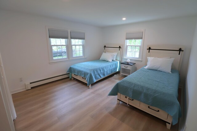 25 Skerry Rd, South Dennis, MA 02660 - bedroom with baseboard heating, light wood-style floors, and recessed lighting