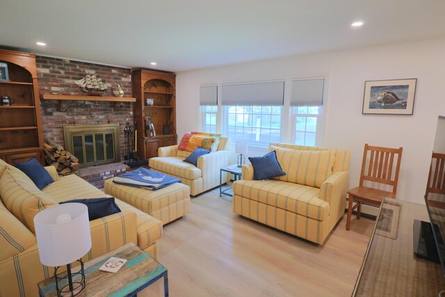 25 Skerry Rd, South Dennis, MA 02660 - living area featuring light wood-style flooring, a brick fireplace, and recessed lighting