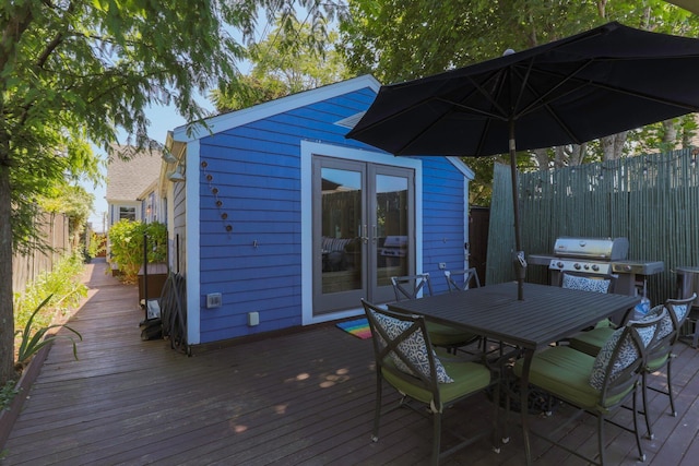 deck with area for grilling and french doors