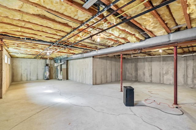 basement featuring heating unit and water heater