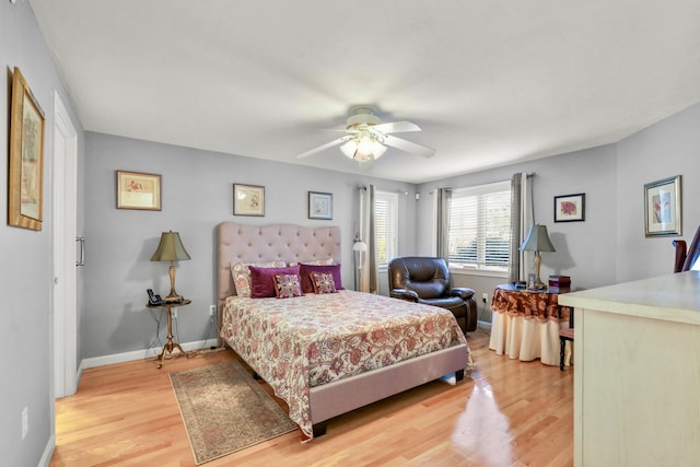 bedroom featuring ceiling fan and light hardwood / wood-style flooring