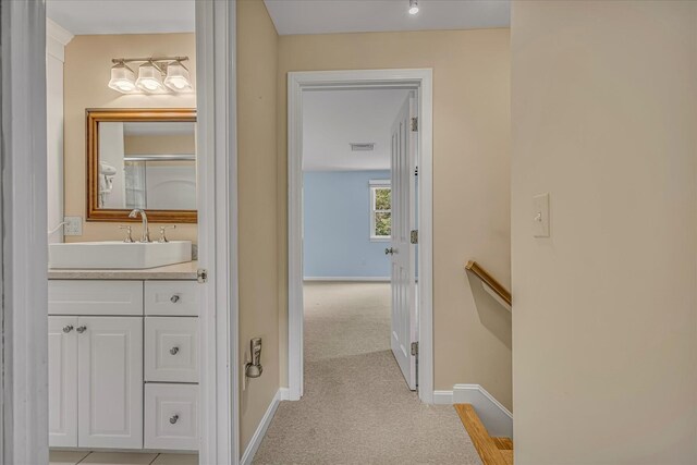 26 Sandy Meadow Way, Eastham, MA 02642 - hall featuring a sink and light colored carpet