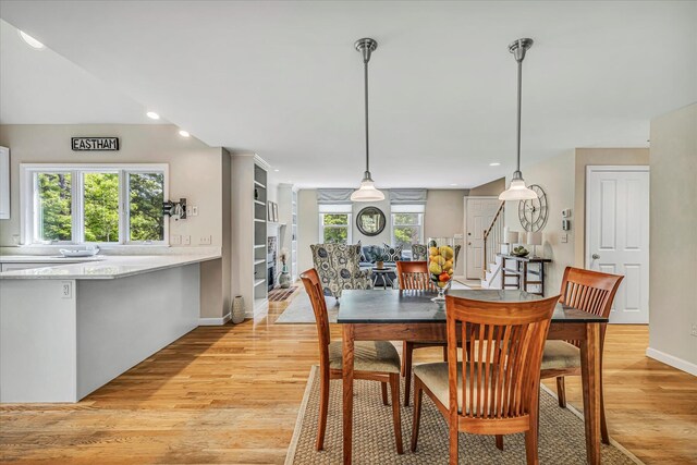 26 Sandy Meadow Way, Eastham, MA 02642 - dining area featuring light wood finished floors, stairway, and recessed lighting
