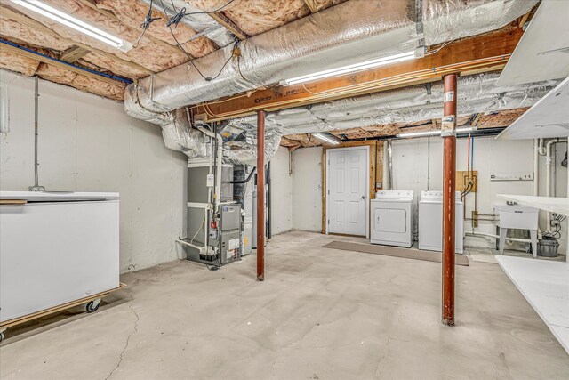 26 Sandy Meadow Way, Eastham, MA 02642 - unfinished below grade area featuring washer and dryer, refrigerator, and heating unit