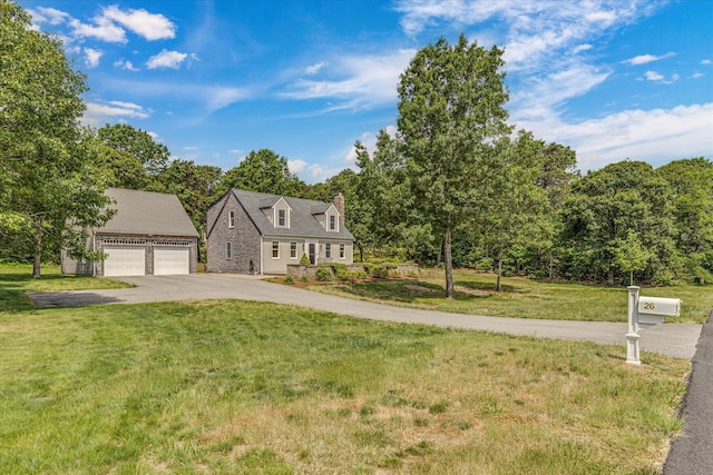 26 Sandy Meadow Way, Eastham, MA 02642 - cape cod house featuring a chimney, a front lawn, a detached garage, an outdoor structure, and asphalt driveway
