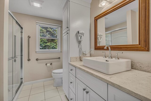 26 Sandy Meadow Way, Eastham, MA 02642 - full bathroom with vanity, an enclosed shower, and tile patterned flooring