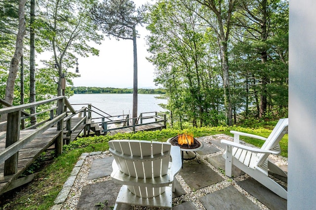 585 Santuit Rd, Cotuit, MA 02635 - view of patio with an outdoor fire pit and a water view