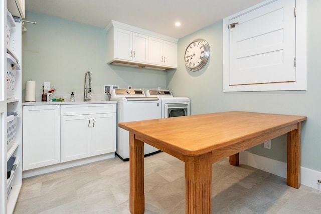 585 Santuit Rd, Cotuit, MA 02635 - washroom with separate washer and dryer, cabinet space, and recessed lighting
