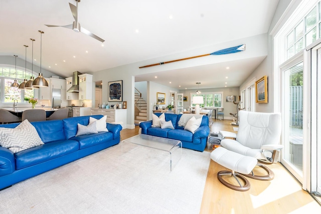 585 Santuit Rd, Cotuit, MA 02635 - living area with stairway, light wood-type flooring, vaulted ceiling, ceiling fan, and recessed lighting