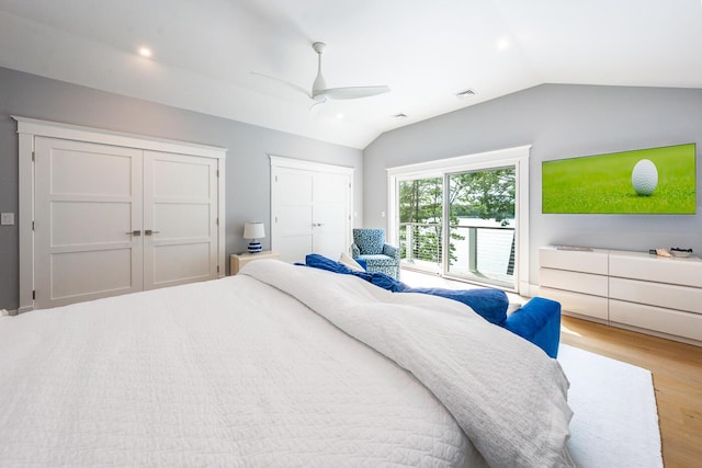 585 Santuit Rd, Cotuit, MA 02635 - bedroom with vaulted ceiling, wood finished floors, two closets, access to outside, and a ceiling fan
