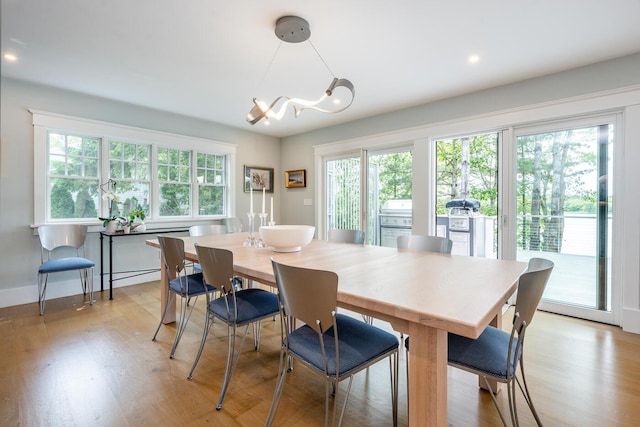 585 Santuit Rd, Cotuit, MA 02635 - dining space featuring a chandelier and light wood finished floors