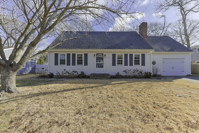 ranch-style house featuring a garage and a front yard