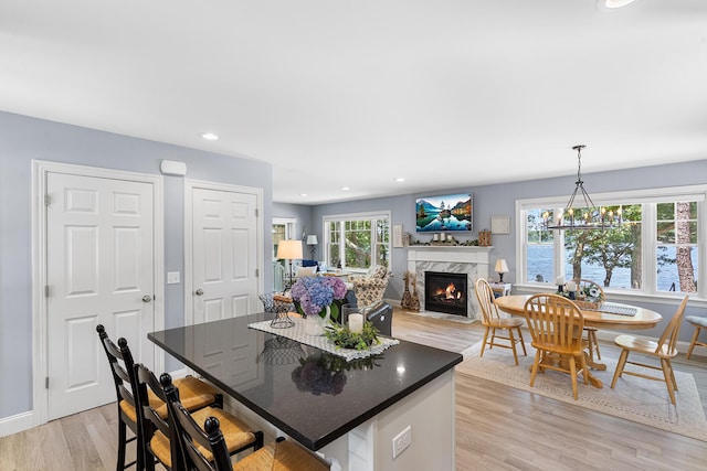10 Stanley Rd, Mashpee, MA 02649 - dining area with a fireplace, light wood-style floors, and recessed lighting