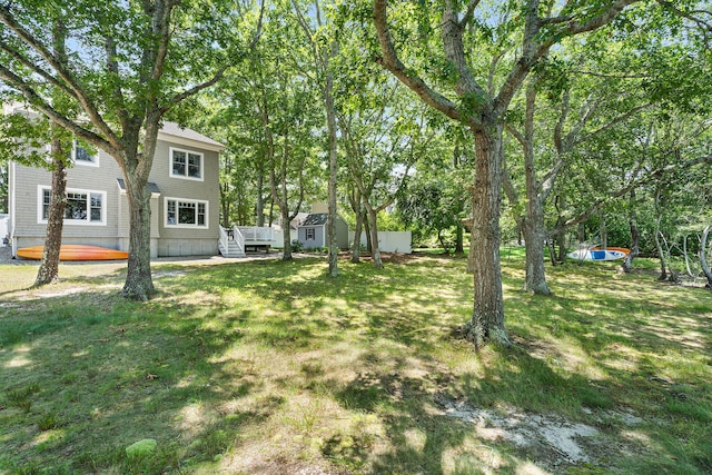 10 Stanley Rd, Mashpee, MA 02649 - view of grassy yard with a wooden deck