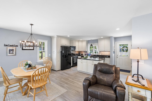 10 Stanley Rd, Mashpee, MA 02649 - dining space with a chandelier, healthy amount of natural light, light wood finished floors, and recessed lighting