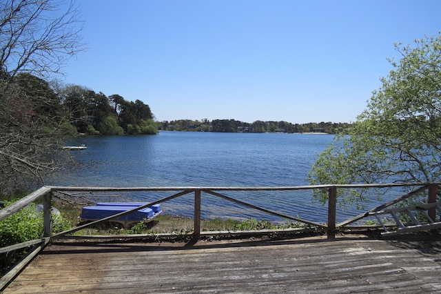 dock area with central AC unit and a water view