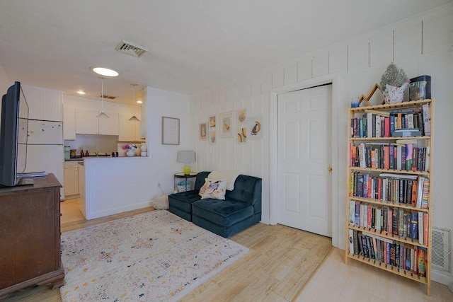 living area featuring light hardwood / wood-style flooring