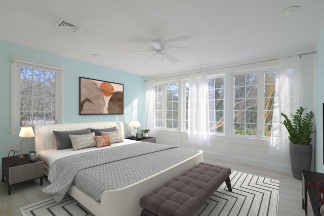 bedroom featuring ceiling fan and light hardwood / wood-style flooring