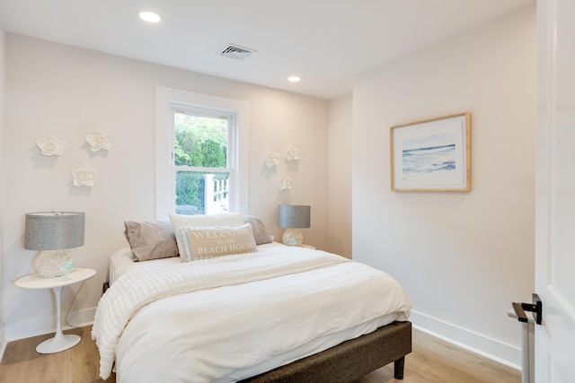 bedroom with light hardwood / wood-style flooring