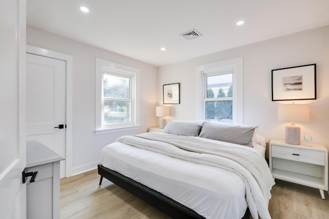 bedroom with light hardwood / wood-style flooring